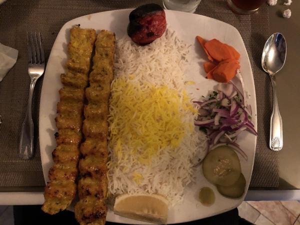 31. Ground Chicken · Chicken koobideh. 2 skewered charbroiled marinated ground chicken. Served with broiled tomato, vegetables and basmati rice with saffron.