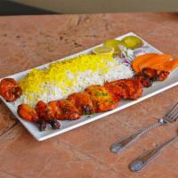 32. Cornish Hen Kabob · Whole charbroiled marinated cornish hen cut into pieces. Served with broiled tomato, vegetab...
