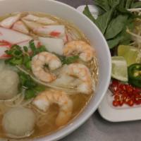 Seafood Pho · Surimi crab meat, fish balls and shrimps. Served with thin rice noodles, bean sprouts, Thai ...