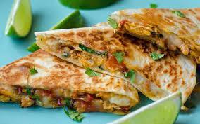 Chicken Quesadilla · Grilled tortilla filled with cheddar cheese. Served with lettuce, tomato and sour cream.