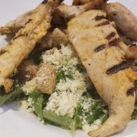 Grilled Chicken Caesar Salad · Crisp romaine, crunchy croutons and Parmesan cheese with house caesar dressing.