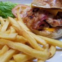 Grilled Chicken American Sandwich · With bacon, American cheese, lettuce and tomatoes on a bun. Served with french fries.