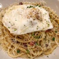 Figs Carbonara · Spaghettini, pancetta, Parmigiano and topped with a fried egg.