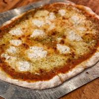 Quattro Formaggio Pizza · Tomato sauce, basil oil, mozzarella, fontina, provolone and herbed ricotta. Vegetarian.