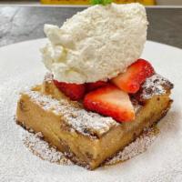 White Chocolate Bread Pudding · butterscotch caramel, whipped cream