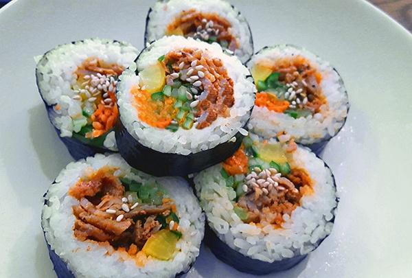 Spicy Pork Roll · Fully cooked spicy pork, seasoned cucumber, carrot, and pickled radish.