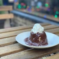 Lava Cake · A chocolate cake filled rich fudge and topped with a sprinkle of powdered sugar