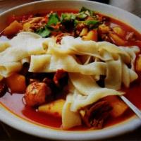 Big Plate Chicken with Xinjiang Style 新疆大盘鸡 · Hot and spicy.