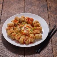 A3. Stinky Tofu · Deep-fried crispy tofu drizzled with fermented sauce and served with pickled cabbage. Vegeta...
