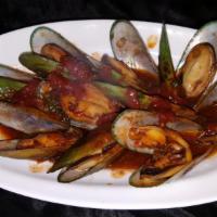 Steamed Green-Lipped Mussels · Mussels, tomato, onions, basil, and Madeira wine.