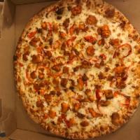 Spicy Buffalo Chicken Pizza · Tender chunks of chicken marinated in a spicy Buffalo wing style sauce, spread out over blue...