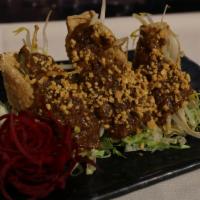 A11. Satay Tofu · Crispy fried tofu stuffed with cucumber and bean sprouts, served with peanut sauce. Spicy.