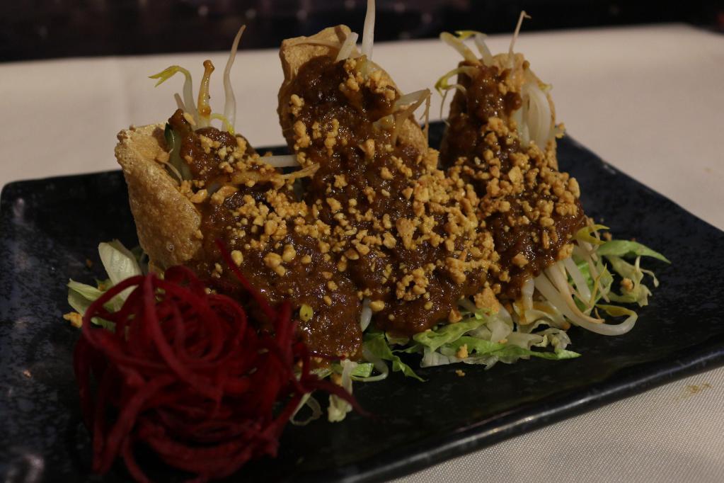A11. Satay Tofu · Crispy fried tofu stuffed with cucumber and bean sprouts, served with peanut sauce. Spicy.