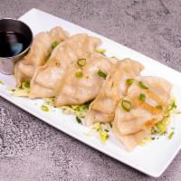 Wok-Seared Dumplings · 5 pieces. Delicately wok-seared dumplings.