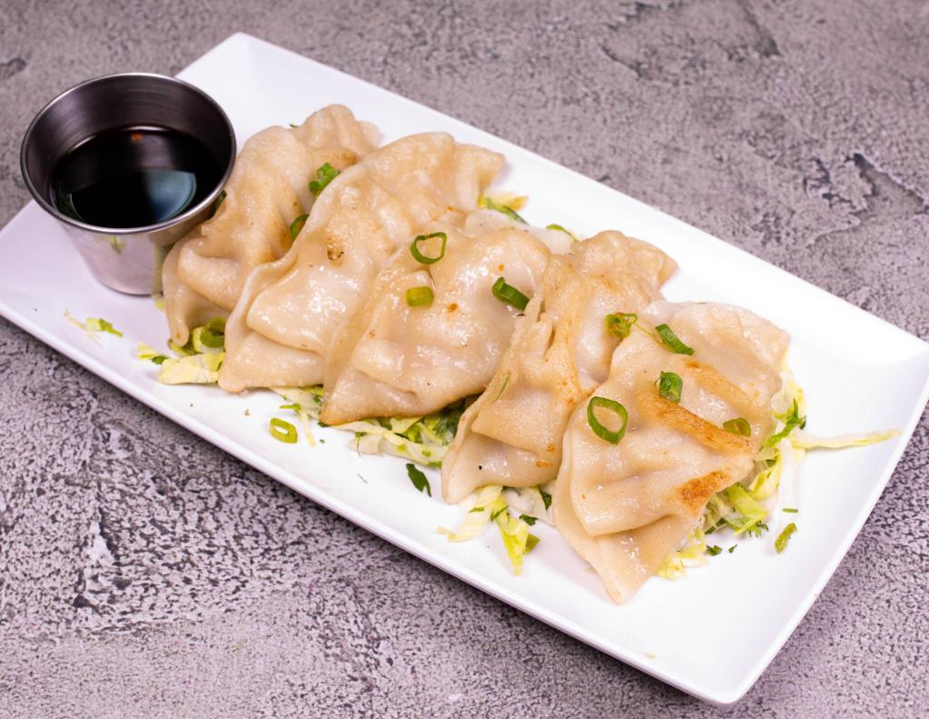 Wok-Seared Dumplings · 5 pieces. Delicately wok-seared dumplings.