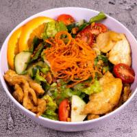Asian Chopped Chicken Salad · Wok-seared breast of chicken with garden mix and fresh orange slices dressed with tangy pean...