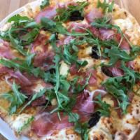 Prosciutto and Fig Pizza · White pizza with black mission figs, goat cheese and arugula.