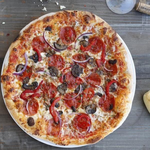 Suprema Pizza · Italian sausage, pepperoni, roasted red peppers, red onions and cremini mushrooms.