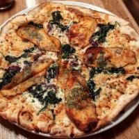 Rosemary Potato Pizza · White pizza with spinach, feta, olive tapenade and truffle oil.