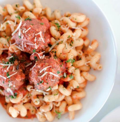 Pasta and Meatballs · Cavatappi pasta (corkscrews) with red sauce and our house-made meatballs, topped with Parmesan.