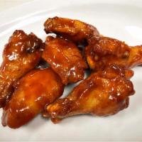 Honey Chicken Wings · Chipotle BBQ –traditional (bone-in) chicken wings hand tossed in a smoky chipotle pepper sau...