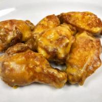 Garlic Chicken Wings · Parmesean –traditional (bone-in) chicken wings hand tossed in a blend of garlic and Parmesan...