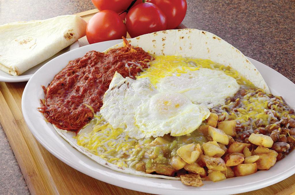 Carne Adovada Rancheros Platter Breakfast · Our twist of the classic. Our specialty shredded pork marinated in red chile. Served with pan fried potatoes, slow cooked pinto beans, 2 eggs of choice, red or green chile, cheese and a side tortilla. 1110-1130 calories.