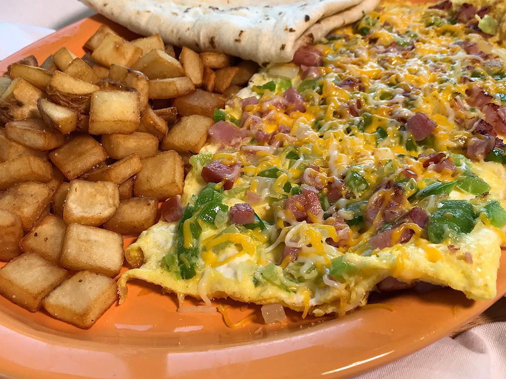 Denver Omelette Platter Breakfast · 4 eggs omelette. Ham, bell pepper, onion, cheese. Comes with pan-fried potatoes and choice of white or wheat toast. 960-1040 calories.