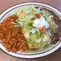 Chimichanga Platter · Crispy fried burrito, choice of meat and chile, topped with topped with cheddar-jack cheese,...
