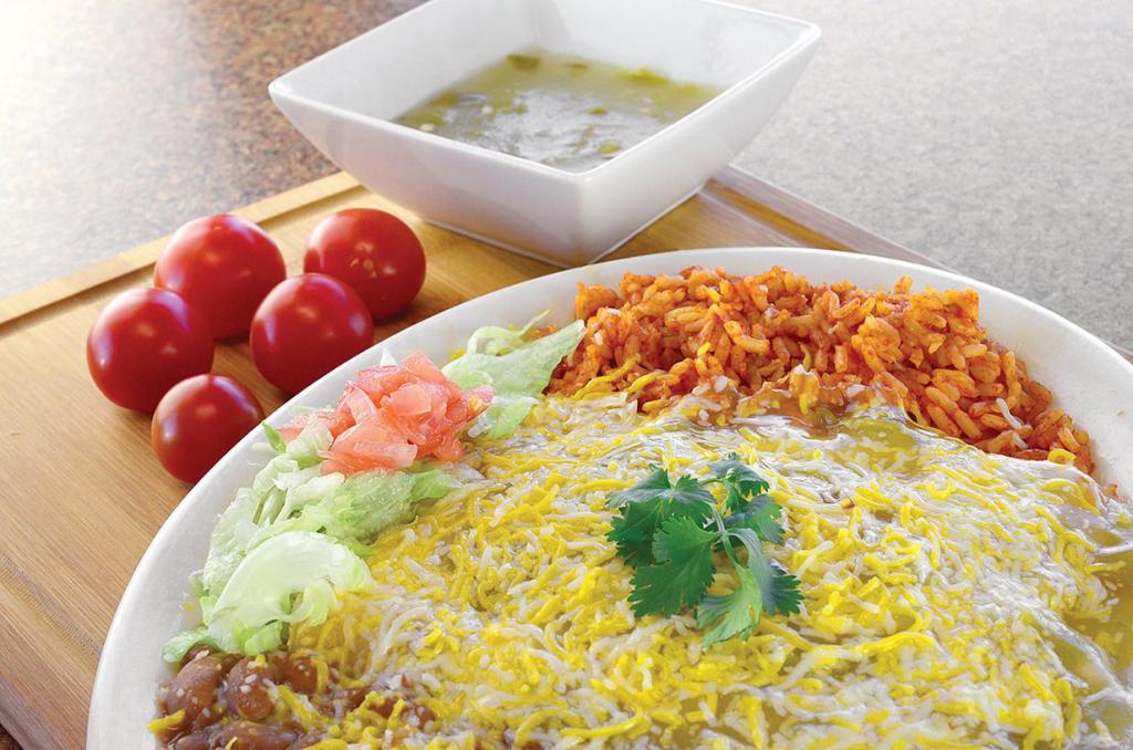 Enchilada Platter · 3 enchiladas, choice of meat and chile, topped with cheddar-jack cheese, lettuce and tomato. Served with rice and beans. 610-970 calories.