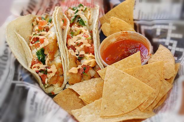 Baja Fish Taco · 2 battered fish fillet tacos, double wrapped in corn tortillas with pico de gallo and spicy aioli sauce. Comes with chips and salsa. 1200 calories.