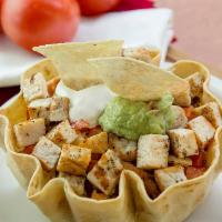 Taco Salad · Crispy flour tortilla bowl filled with lettuce. Choice of seasoned ground beef or sliced gri...