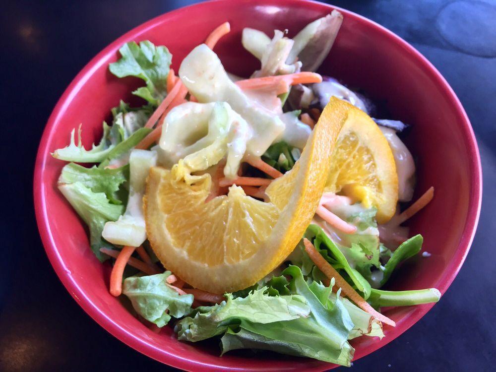 House Salad · Fresh Gourmet Salad with Cucumber Slices and Carrots & Omakase's House Sesame Peanut Dressing