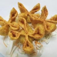 Crab Rangoon 蟹角 · 4 pcs Deep fried wontons stuffed with ground, cream cheese, avocado and crab stick.