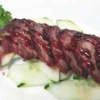 BBQ Pork (Char Siu) 叉烧头台 · Cantonese style marinated bbq pork, slice in layers served on bed of cucumber.