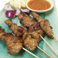 Satay Beef 马来式牛串 · 4 Marinated beef on skewer grilled to perfection. Served with onion, cucumber and peanut sau...