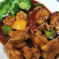 General Tso's Chicken 左宗鸡 · Battered fried chunks dark meat chicken sautéed in sweet and spicy brown sauce with bell pep...