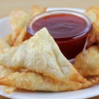 24. Fried Cheese Wonton (Crab Rangoon) 芝士云吞 · 8 pieces and serve with sweet and sour sauce on the side.