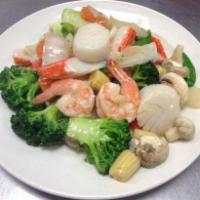 Seafood Delight · Lobster, jumbo shrimp, scallops, king crab meat sauteed with mixed vegetables in special whi...