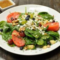 Spinach Salad · Vegetarian. Fresh baby spinach, tomatoes, seasonal fruits, walnuts, goat cheese, roasted red...