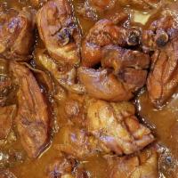 Adobo Chicken Large · Filipino staple dish cooked in vinegar, soy, and garlic.