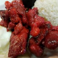 Tosilog · Pan fried Sliced pork in house sweet marinade served with 2 eggs and scoop of garlic rice.