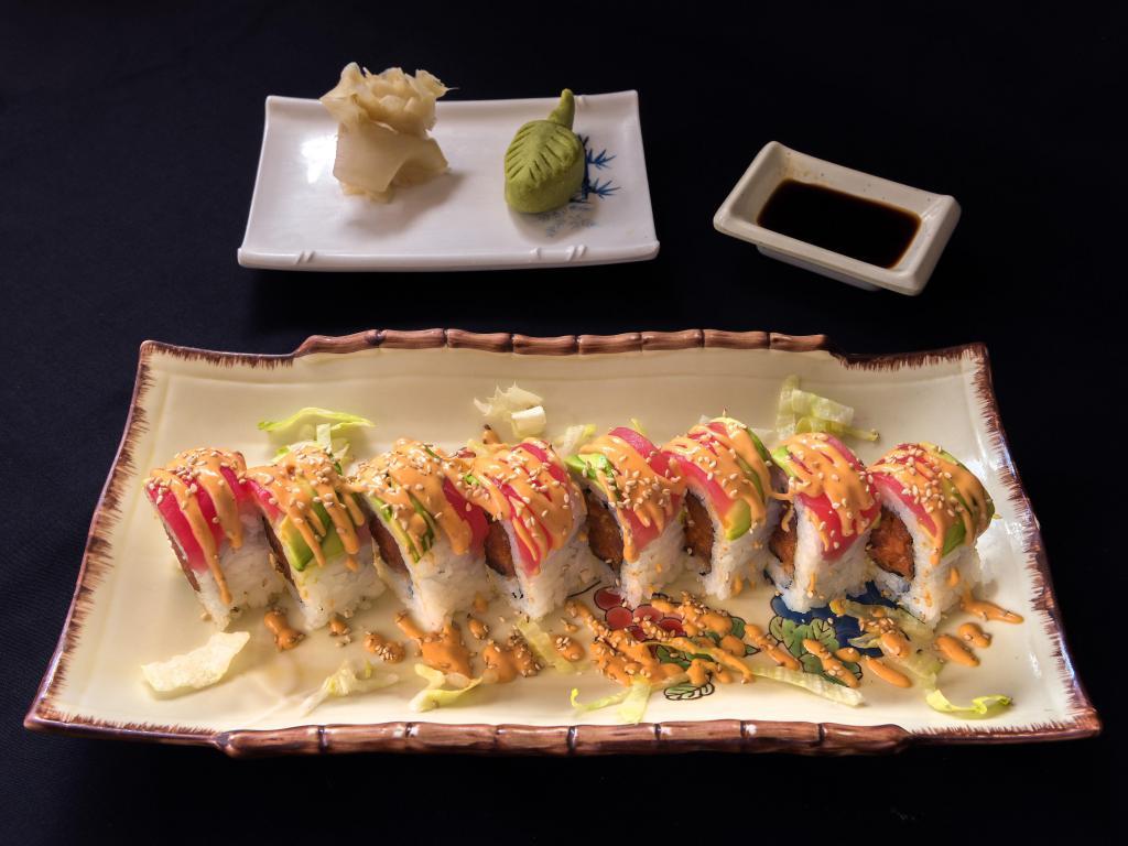 12. Rockies Roll · 8 pieces. Spicy tuna inside, tuna and avocado outside and spicy mayo on topped. Raw.