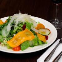 Mixed Greens Salad · Organic mixed lettuce, cherry tomatoes, cucumbers, carrots and Italian dressing.