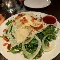 Arugula Salad · Sliced bresaola, arugula, sliced fennel and shredded Parmigiano Reggiano served with a lemon...