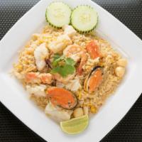 44. Seafood Fried Rice · Pan-fried rice with shrimps, squid, mussels, fish, scallops, egg and onions.