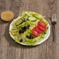 Green Salad · Lettuce, tomatoes, cucumber little black olives on the side.
With Italian Dressing 
