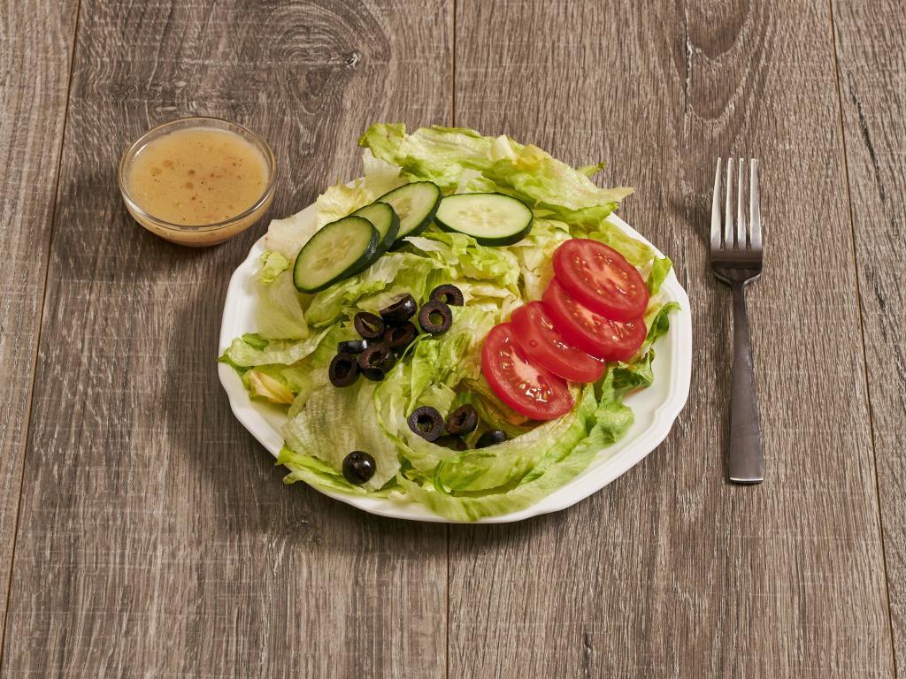 Green Salad · Lettuce, tomatoes, cucumber little black olives on the side.
With Italian Dressing 
