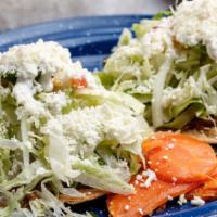 2 Tostadas Plato · Topped with shredded beef, lettuce tomato, onion, avocado, sour cream & cheese.
