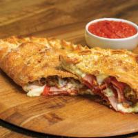 All Meat Calzone · Our handmade dough stuffed with pepperoni, ham, italian sausage, bacon, and our signature th...